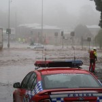 Emergency service workers prepare to rescue a woman from the roof of her car as water rushes through Toowoomba during the 2010-11 Queensland Flood / Tim Swinson (Wikimedia Commons)