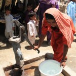 Providing clean water and flood-resistant shelter  Sabiha Khatoon collects clean water from a pump installed in her village with funding from DFID / Vicki Francis/DFID